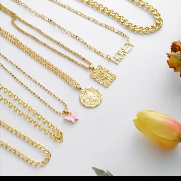 Golden Layered Necklace with Heart and Engraved Pendants
7 piece set - Picture 5 of 6